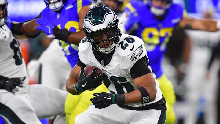 Nov 24, 2024; Inglewood, California, USA; Philadelphia Eagles running back Saquon Barkley (26) runs the ball against the Los Angeles Rams during the first half at SoFi Stadium. Mandatory Credit: Gary A. Vasquez-Imagn Images