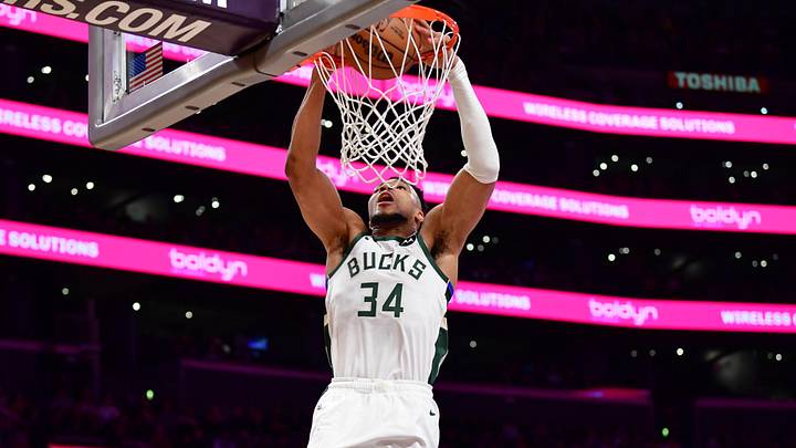 Jan 9, 2026; Los Angeles, California, USA; Milwaukee Bucks forward Giannis Antetokounmpo (34) dunks for the basket against the Los Angeles Lakers during the first half at Crypto.com Arena. Mandatory Credit: Gary A. Vasquez-Imagn Images
