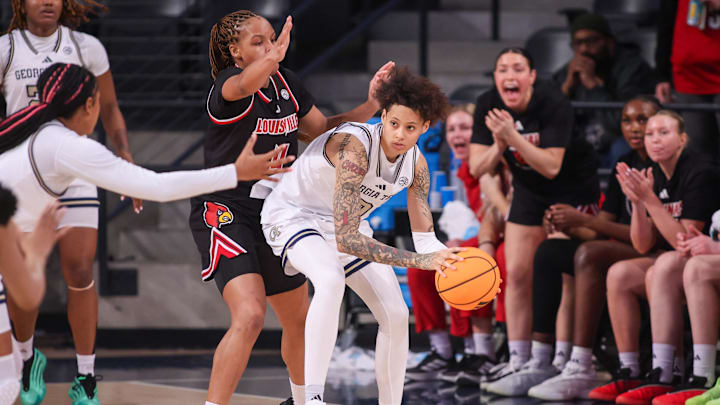 Feb 26, 2026; Atlanta, Georgia, USA; Georgia Tech Yellow Jackets guard Brianna Turnage (0) is defended by Louisville Cardinals forward MacKenly Randolph (4) in the second quarter at McCamish Pavilion. Mandatory Credit: Brett Davis-Imagn Images