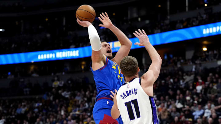 Jan 23, 2025; Denver, Colorado, USA; Denver Nuggets center Nikola Jokic (15) shoots over Sacramento Kings forward Domantas Sabonis (11) in the first quarter at Ball Arena. Mandatory Credit: Ron Chenoy-Imagn Images Jan 23, 2025; Denver, Colorado, USA; Denver Nuggets center Nikola Jokic (15) shoots over Sacramento Kings forward Domantas Sabonis (11) in the first quarter at Ball Arena. Mandatory Credit: Ron Chenoy-Imagn Images
