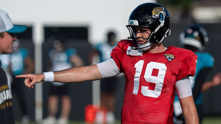Jacksonville Jaguars quarterback Seth Henigan (19) directs a receiver during the Jaguars 14th NFL training camp session at Miller Electric Center Tuesday August 12, 2025 in Jacksonville, Fla. The Jaguars travel to New Orleans to play the Saints this Sunday in their second preseason game. [Doug Engle/Florida Times-Union]