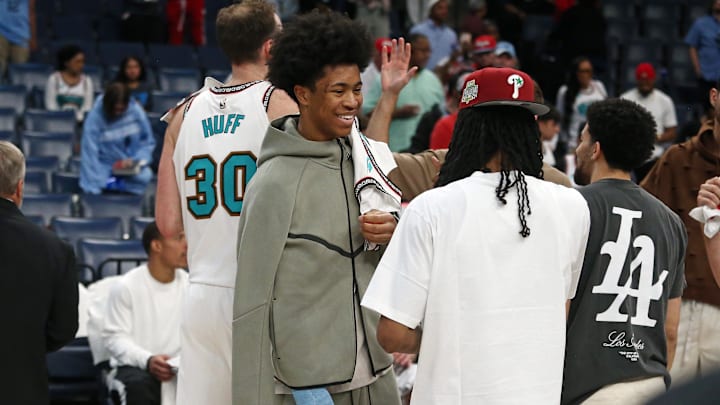 Apr 13, 2025; Memphis, Tennessee, USA; Memphis Grizzlies forward Jaylen Wells (0) reacts with guard Ja Morant (12) after defeating the Dallas Mavericks at FedExForum. Mandatory Credit: Petre Thomas-Imagn Images
