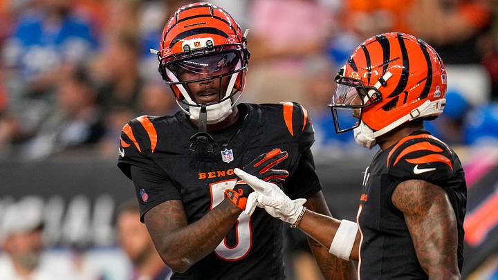 Cincinnati Bengals wide receiver Tee Higgins (5) and Cincinnati Bengals wide receiver Ja'Marr Chase (1) celebrate a touchdown in the fourth quarter of the NFL Week 5 game between the Cincinnati Bengals and the Detroit Lions at Paycor Stadium in downtown Cincinnati on Sunday, Oct. 5, 2025. The Bengals continued a losing streak, falling 37-24 to the Lions.