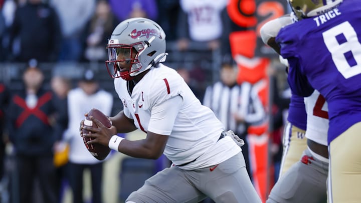 Nov 25, 2023; Seattle, Washington, USA; Washington State Cougars quarterback Cameron Ward (1) scrambles out of the pocket against the Washington Huskies during the first quarter at Alaska Airlines Field at Husky Stadium. Mandatory Credit: Joe Nicholson-USA TODAY Sports Nov 25, 2023; Seattle, Washington, USA; Washington State Cougars quarterback Cameron Ward (1) scrambles out of the pocket against the Washington Huskies during the first quarter at Alaska Airlines Field at Husky Stadium. Mandatory Credit: Joe Nicholson-USA TODAY Sports