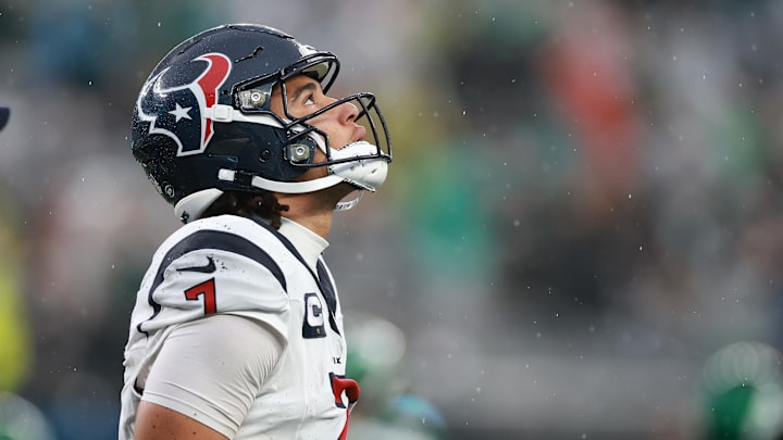 Dec 10, 2023; East Rutherford, New Jersey, USA; Houston Texans quarterback C.J. Stroud (7) walks off the field after an apparent injury during the second half against the New York Jets at MetLife Stadium. Mandatory Credit: Vincent Carchietta-Imagn Images