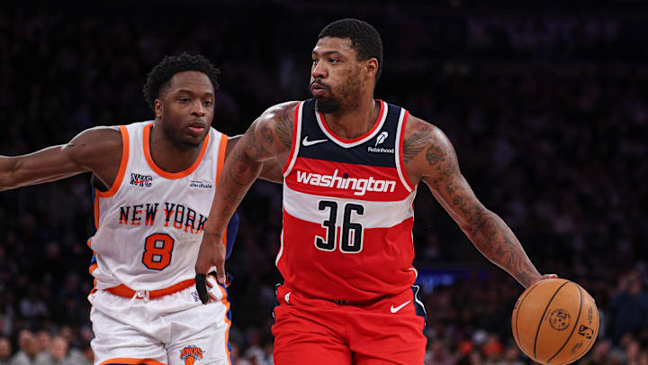 Mar 22, 2025; New York, New York, USA; Washington Wizards guard Marcus Smart (36) dribbles up court in front of New York Knicks forward OG Anunoby (8) during the second half at Madison Square Garden. Mandatory Credit: Vincent Carchietta-Imagn Images