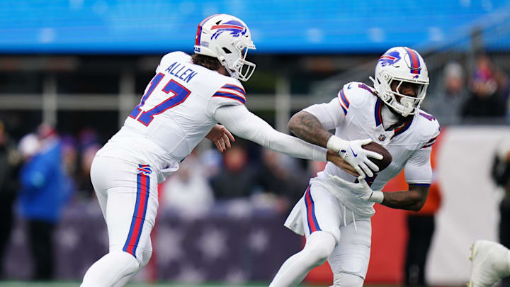 Jan 5, 2025; Foxborough, Massachusetts, USA; Buffalo Bills quarterback Josh Allen (17) hands off the ball to running back James Cook (4) against the New England Patriots in the first quarter at Gillette Stadium.