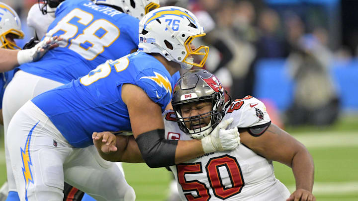 Dec 15, 2024; Inglewood, California, USA; Los Angeles Chargers offensive tackle Joe Alt (76) blocks Tampa Bay Buccaneers defensive tackle Vita Vea (50) in the second half at SoFi Stadium. Mandatory Credit: Jayne Kamin-Oncea-Imagn Images