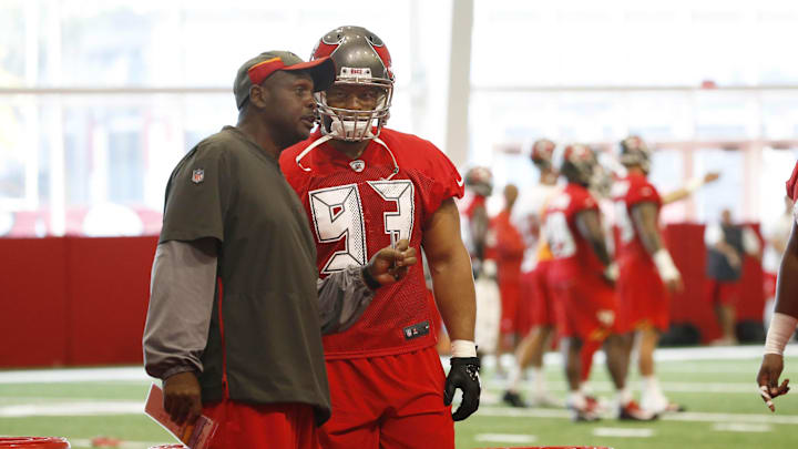 Tampa Bay Buccaneers nose tackle Ndamukong Suh (93) talks with defensive line coach Kacy Rodgers.