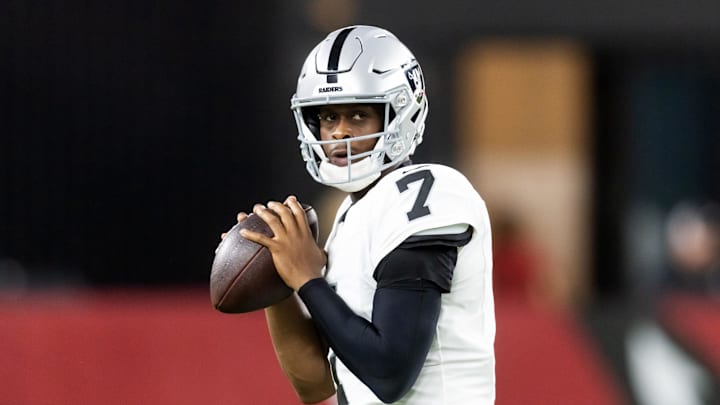 Aug 23, 2025; Glendale, Arizona, USA; Las Vegas Raiders quarterback Geno Smith (7) against the Arizona Cardinals during a preseason NFL game at State Farm Stadium. Mandatory Credit: Mark J. Rebilas-Imagn Images