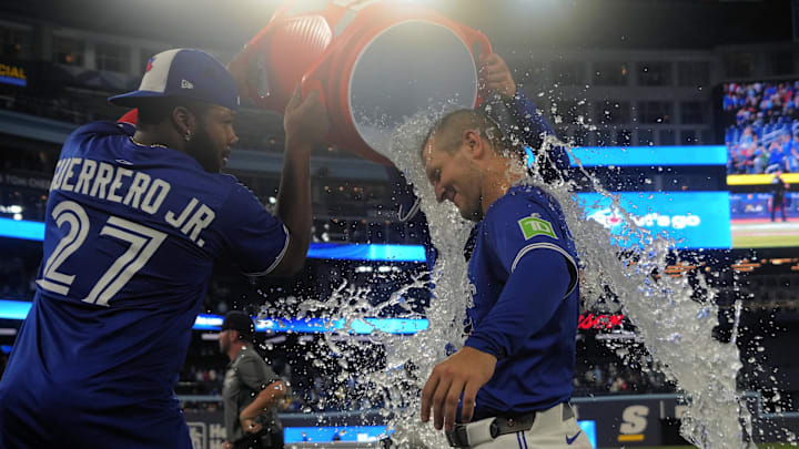 Toronto Blue Jays center fielder Daulton Varsho (5) gets doused with ice water by first baseman Vladimir Guerrero Jr. (27) after a win over the Boston Red Sox at Rogers Centre. Toronto Blue Jays center fielder Daulton Varsho (5) gets doused with ice water by first baseman Vladimir Guerrero Jr. (27) after a win over the Boston Red Sox at Rogers Centre.