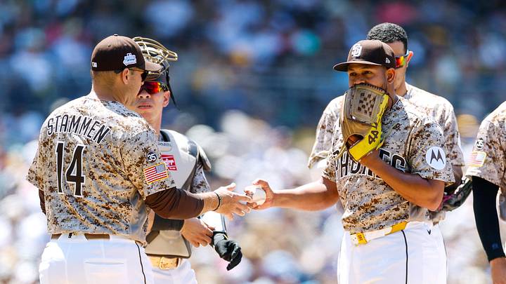 San Diego Padres manager Craig Stammen (14) takes the ball from starting pitcher Randy Vasquez (98) during a fifth inning pitching change against the New York Mets at Petco Park on June 7, 2026. San Diego Padres manager Craig Stammen (14) takes the ball from starting pitcher Randy Vasquez (98) during a fifth inning pitching change against the New York Mets at Petco Park on June 7, 2026.