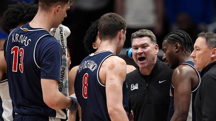 Feb 9, 2026; Lawrence, Kansas, USA; Arizona Wildcats head coach Tommy Lloyd talks to players during the first half against the Kansas Jayhawks at Allen Fieldhouse. Mandatory Credit: Jay Biggerstaff-Imagn Images Feb 9, 2026; Lawrence, Kansas, USA; Arizona Wildcats head coach Tommy Lloyd talks to players during the first half against the Kansas Jayhawks at Allen Fieldhouse. Mandatory Credit: Jay Biggerstaff-Imagn Images