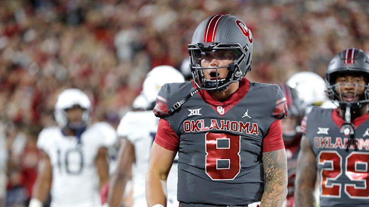Oklahoma's Dillon Gabriel (8) celebrates a touchdown in the first half of a college football game