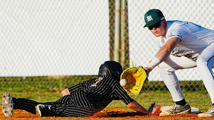 Bryce Conner of Melbourne awaits the pickoff throw as Viera’s Bryce Hudkin dives back to first during their game on March 11, 2026.