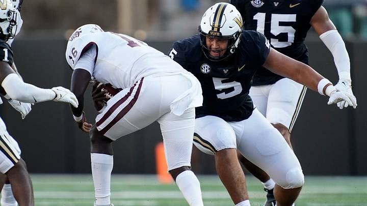 Vanderbilt defensive lineman Yilanan Ouattara (5) pulls down Alabama A&M quarterback Xavier Lankford (16) during the first quarter at FirstBank Stadium in Nashville, Tenn., Saturday, Sept. 2, 2023. Vanderbilt defensive lineman Yilanan Ouattara (5) pulls down Alabama A&M quarterback Xavier Lankford (16) during the first quarter at FirstBank Stadium in Nashville, Tenn., Saturday, Sept. 2, 2023.