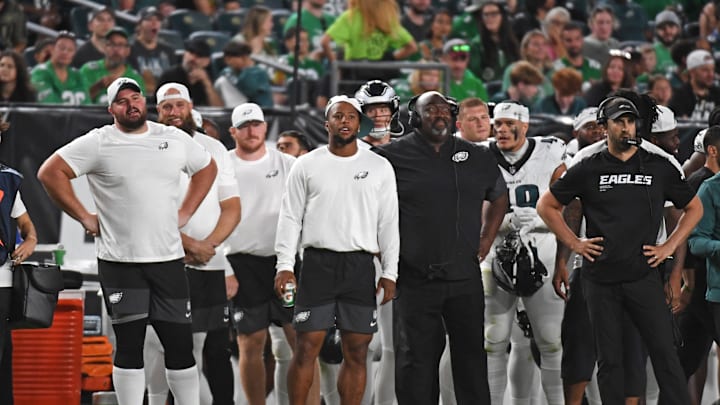 Aug 7, 2025; Philadelphia, Pennsylvania, USA; Philadelphia Eagles guard Landon Dickerson (69), running back Saquon Barkley (26) and head coach Nick Sirianni on the sidelines against the Cincinnati Bengals during the second quarter at Lincoln Financial Field. Mandatory Credit: Eric Hartline-Imagn Images