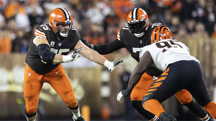 Oct 31, 2022; Cleveland, Ohio, USA; Cleveland Browns guard Joel Bitonio (75) and offensive tackle Jedrick Wills Jr. (71) block Cincinnati Bengals defensive tackle Zach Carter (95) during the second quarter at FirstEnergy Stadium. Mandatory Credit: Scott Galvin-Imagn Images