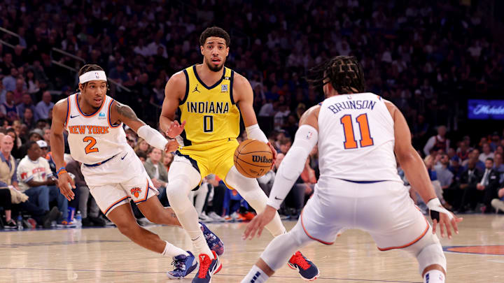 Indiana Pacers guard Tyrese Haliburton controls the ball against New York Knicks guards Miles McBride and Jalen Brunson during the first quarter of game seven of the second round of the NBA playoffs at Madison Square Garden. Mandatory Credit: Brad Penner-Imagn Images