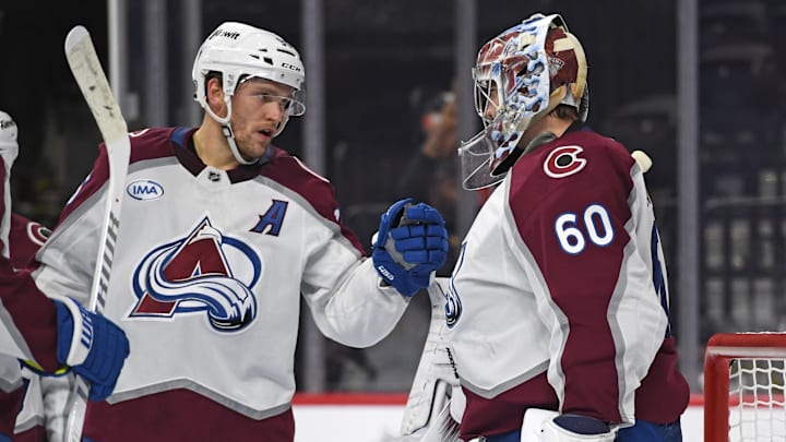 Nov 18, 2024; Philadelphia, Pennsylvania, USA; Colorado Avalanche right wing Mikko Rantanen (96) and goaltender Justus Annunen (60) celebrate win against the Philadelphia Flyers at Wells Fargo Center. Mandatory Credit: Eric Hartline-Imagn Images