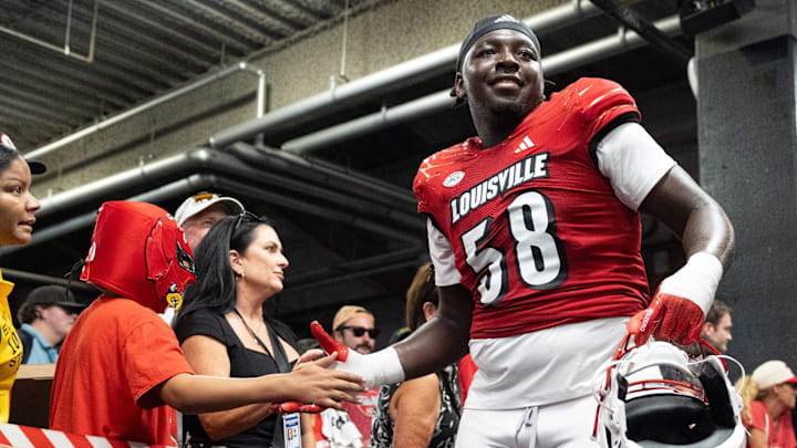 Louisville Cardinals defensive lineman Xavier Porter (58) high fives fans as he heads back into the locker room after their game against the Austin Peay Governors on Saturday, Aug. 31, 2024 at L&N Federal Credit Union Stadium in Louisville, Ky. The Louisville Cardinals beat the Austin Peay Governors 62-0.