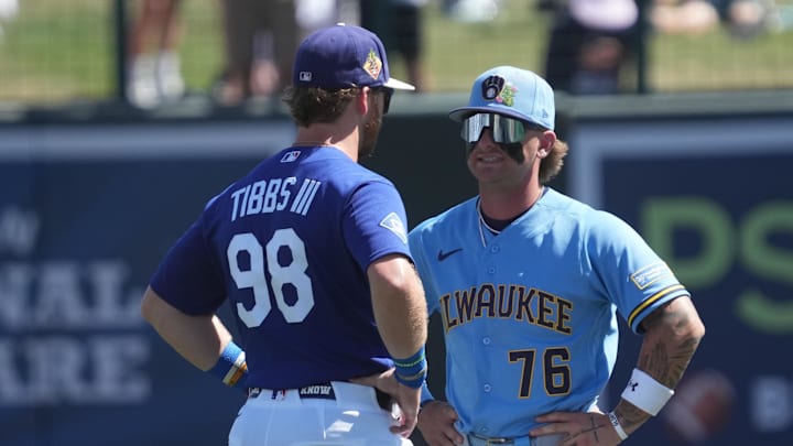 Mar 16, 2026; Phoenix, Arizona, USA; Los Angeles Dodgers right fielder James Tibbs III (98) and Milwaukee Brewers shortstop Jett Williams (76) talk before a game at Camelback Ranch-Glendale. Mandatory Credit: Rick Scuteri-Imagn Images