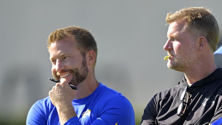 Jul 29, 2024; Los Angeles, CA, USA; Los Angeles Rams head coach Sean McVay, general manager Les Snead and chief of staff Carter Crutchfield talk on the field during training camp at Loyola Marymount University. Mandatory Credit: Jayne Kamin-Oncea-Imagn Images