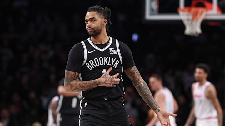 Feb 7, 2025; Brooklyn, New York, USA; Brooklyn Nets guard D'Angelo Russell (1) reacts after making a three point basket during the second half against the Miami Heat at Barclays Center. Mandatory Credit: Vincent Carchietta-Imagn Images