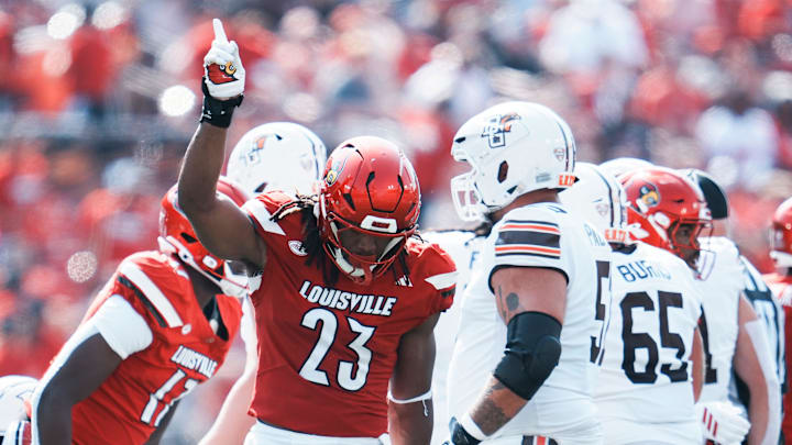 Louisville Cardinals defensive lineman Wesley Bailey (23) had a stop on Bowling Green Falcons wide receiver Allen Middleton (1) in the first half against Bowling Green at L&N Federal Credit Union Stadium in Louisville, Kentucky Sept. 20, 2025.