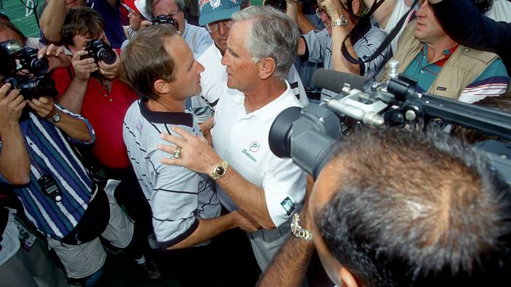 Miami Dolphins head coach Don Shula shakes hands with his son David Shula, the head coach of the Cincinnati Bengals after the Dolphins defeated the Bengals 26-23 at Riverfront Stadium in 1995. Miami Dolphins head coach Don Shula shakes hands with his son David Shula, the head coach of the Cincinnati Bengals after the Dolphins defeated the Bengals 26-23 at Riverfront Stadium in 1995.