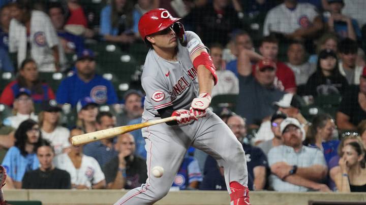 Aug 30, 2026; Chicago, Illinois, USA;  Cincinnati Reds first baseman Sal Stewart (27) hits a infield single against the Chicago Cubs during the ninth inning at Wrigley Field.  Mandatory Credit: David Banks-Imagn Images