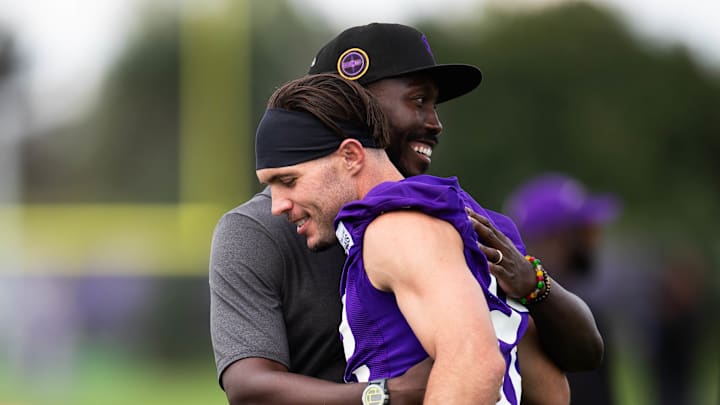 Vikings GM Kwesi Adofo-Mensah and veteran safety Harrison Smith. 