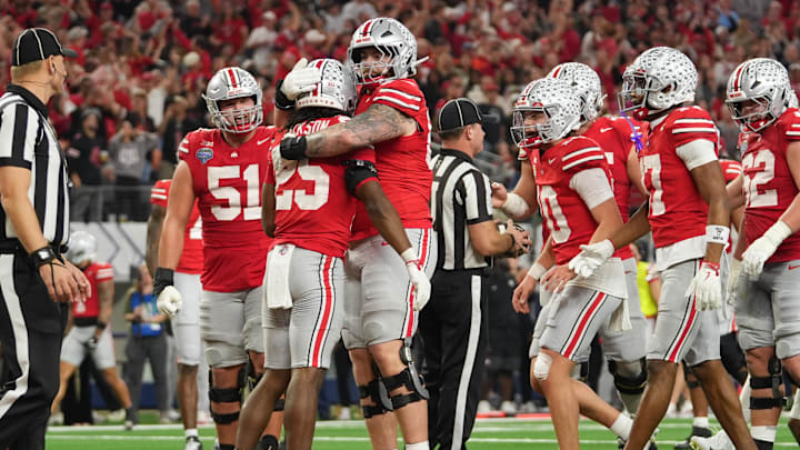 Dec 31, 2025; Arlington, TX, USA; Ohio State Buckeyes running back Bo Jackson (25) celebrates a touchdown  with offensive lineman Ian Moore (69) in the third quarter against the Miami Hurricanes during the 2025 Cotton Bowl and quarterfinal game of the College Football Playoff at AT&T Stadium. Mandatory Credit: Raymond Carlin III-Imagn Images