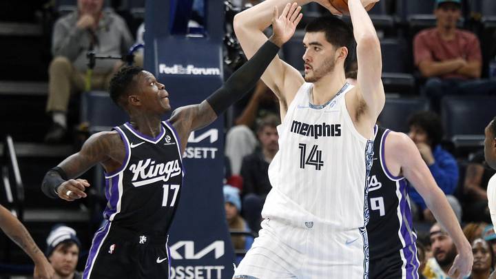 Nov 20, 2025; Memphis, Tennessee, USA; Memphis Grizzlies center Zach Edey (14) handles the ball as Sacramento Kings guard Dennis Schroder (17) defends during the second quarter at FedExForum. Mandatory Credit: Petre Thomas-Imagn Images
