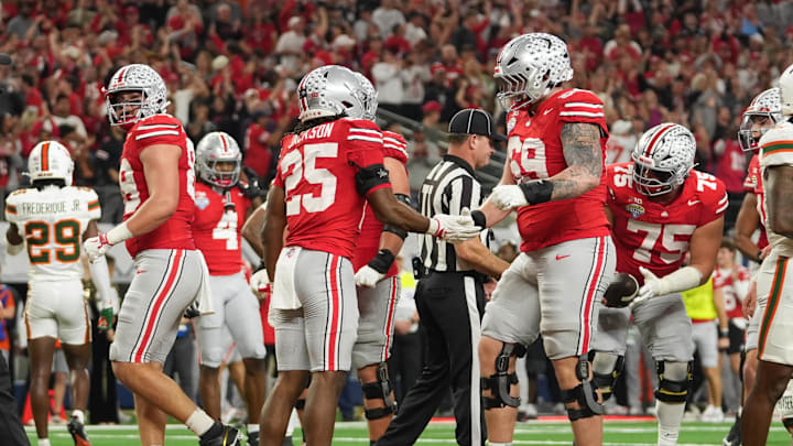 Dec 31, 2025; Arlington, TX, USA; Ohio State Buckeyes running back Bo Jackson (25) celebrates a touchdown  with offensive lineman Ian Moore (69) in the third quarter against the Miami Hurricanes during the 2025 Cotton Bowl and quarterfinal game of the College Football Playoff at AT&T Stadium. Mandatory Credit: Raymond Carlin III-Imagn Images