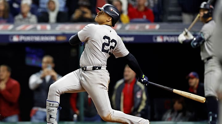 Oct 19, 2024; Cleveland, Ohio, USA; New York Yankees outfielder Juan Soto (22) hits a two run home run during the tenth inning against the Cleveland Guardians during game five of the ALCS for the 2024 MLB playoffs at Progressive Field.
