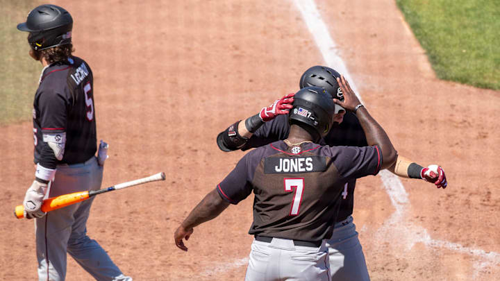 Gamecocks catcher Dalton Reeves (44) celebrates his two run homer with Gamecocks outfielder Kennedy Jones (7) in the top of the ninth inning against Florida. The Gators beat the South Carolina 11-9 at Condron Family Ballpark in Gainesville, Florida, Sunday, April 14, 2024. [Cyndi Chambers/ Gainesville Sun] 2024
