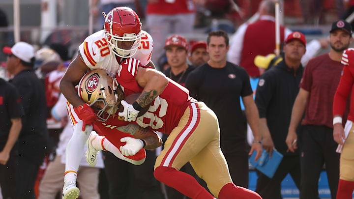 Kansas City Chiefs safety Justin Reid (20) and San Francisco 49ers tight end George Kittle (85)