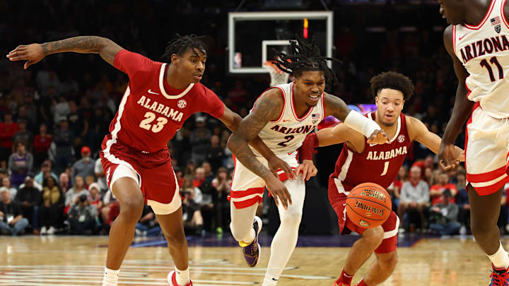 Dec 20, 2023; Phoenix, Arizona, USA; Arizona Wildcats guard Caleb Love (2) against Alabama Crimson Tide forward Nick Pringle (23) and guard Mark Sears (1) in the Hall of Fame Series at Footprint Center. Mandatory Credit: Mark J. Rebilas-USA TODAY Sports Dec 20, 2023; Phoenix, Arizona, USA; Arizona Wildcats guard Caleb Love (2) against Alabama Crimson Tide forward Nick Pringle (23) and guard Mark Sears (1) in the Hall of Fame Series at Footprint Center. Mandatory Credit: Mark J. Rebilas-USA TODAY Sports