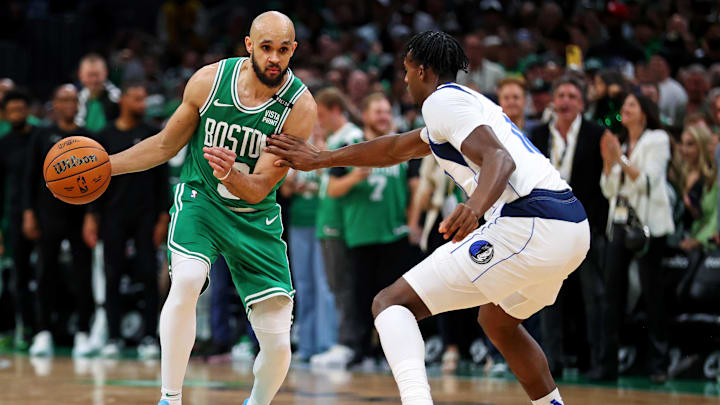 Jun 17, 2024; Boston, Massachusetts, USA; Boston Celtics guard Derrick White (9) handles the ball against the Dallas Mavericks in game five of the 2024 NBA Finals at TD Garden. Mandatory Credit: Peter Casey-Imagn Images Jun 17, 2024; Boston, Massachusetts, USA; Boston Celtics guard Derrick White (9) handles the ball against the Dallas Mavericks in game five of the 2024 NBA Finals at TD Garden. Mandatory Credit: Peter Casey-Imagn Images
