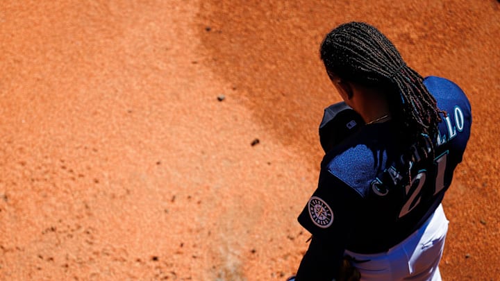 Seattle Mariners starting pitcher Luis Castillo (21) holds his hat during the national anthem in the bullpen before facing the Chicago White Sox at T-Mobile Park in 2022.