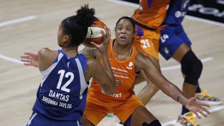 Sep 17, 2020; Palmetto, Florida, USA; Phoenix Mercury center Kia Vaughn (1) guards Minnesota Lynx forward Damiris Dantas (12) during the second half at the FELD entertainment complex. Mandatory Credit: Reinhold Matay-Imagn Images