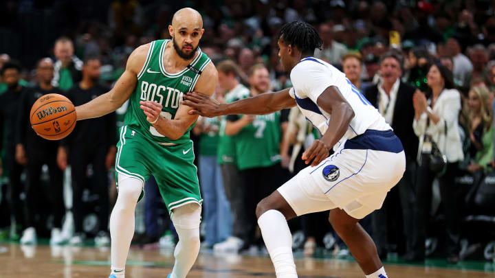 Jun 17, 2024; Boston, Massachusetts, USA; Boston Celtics guard Derrick White (9) handles the ball against the Dallas Mavericks in game five of the 2024 NBA Finals at TD Garden. Mandatory Credit: Peter Casey-USA TODAY Sports Jun 17, 2024; Boston, Massachusetts, USA; Boston Celtics guard Derrick White (9) handles the ball against the Dallas Mavericks in game five of the 2024 NBA Finals at TD Garden. Mandatory Credit: Peter Casey-USA TODAY Sports