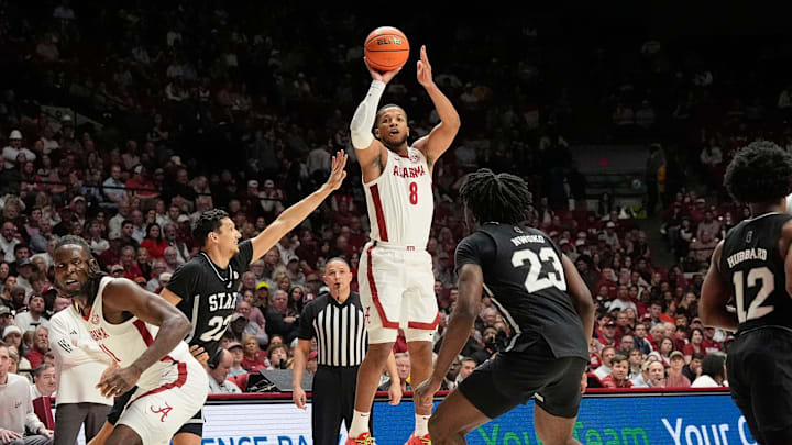 Feb 25, 2025; Tuscaloosa, AL, USA; Alabama guard Chris Youngblood (8) shoots a three and is defended by Mississippi State forward RJ Melendez (22) at Coleman Coliseum. Mandatory Credit: Gary Cosby Jr.-Tuscaloosa News