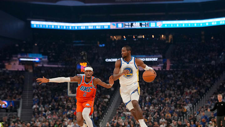 Dec 2, 2025; San Francisco, California, USA; Golden State Warriors forward Jonathan Kuminga (1) dribbles the ball next to Oklahoma City Thunder guard Shai Gilgeous-Alexander (2) in the first quarter at the Chase Center. Mandatory Credit: Cary Edmondson-Imagn Images