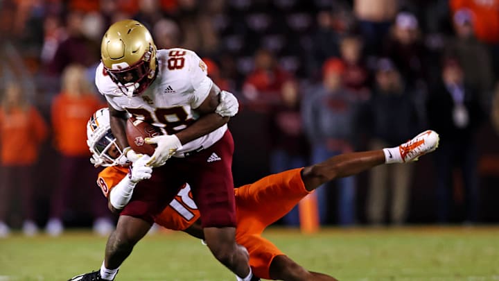 Oct 17, 2024; Blacksburg, Virginia, USA; Boston College Eagles tight end Kamari Morales (88) catches a pass against Virginia Tech Hokies safety Mose Phillips III (18) during the third quarter at Lane Stadium. Mandatory Credit: Peter Casey-Imagn Images