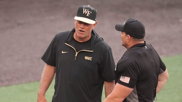 Wake Forest baseball coach Tom Walter talks to the umpire at the NCAA college baseball Knoxville Regional final againstTennessee on June 1, 2025, in Knoxville, Tenn.