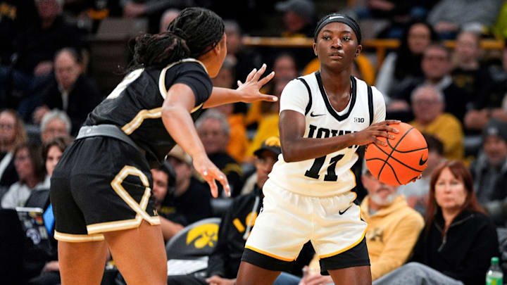 Iowa guard Chit-Chat Wright (11) looks to pass the ball against the Lindenwood Lions Dec. 13, 2025 at Carver-Hawkeye Arena in Iowa City, Iowa. Iowa guard Chit-Chat Wright (11) looks to pass the ball against the Lindenwood Lions Dec. 13, 2025 at Carver-Hawkeye Arena in Iowa City, Iowa.