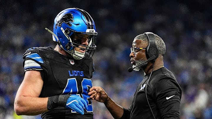 Detroit Lions defensive coordinator Aaron Glenn talks with linebacker Jack Campbell during the first half against the Minnesota Vikings at Ford Field in Detroit on Sunday, Jan. 5, 2025.