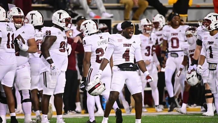 Troy Trojans players react after defeating the Southern Miss Golden Eagles during a college football game between Southern Miss and Troy at M.M. Roberts Stadium in Hattiesburg, Miss., on Saturday, Nov. 29, 2025. Troy defeated Southern Miss 28-18.
